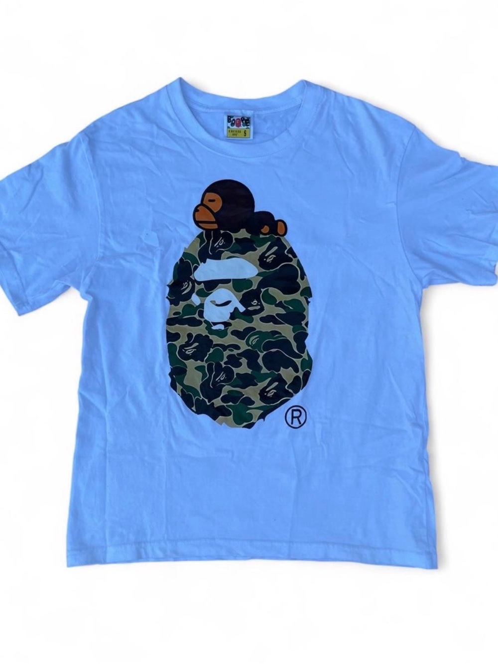 BAPE Kids Light Blue Tee with Green Camo Ape Head Graphic